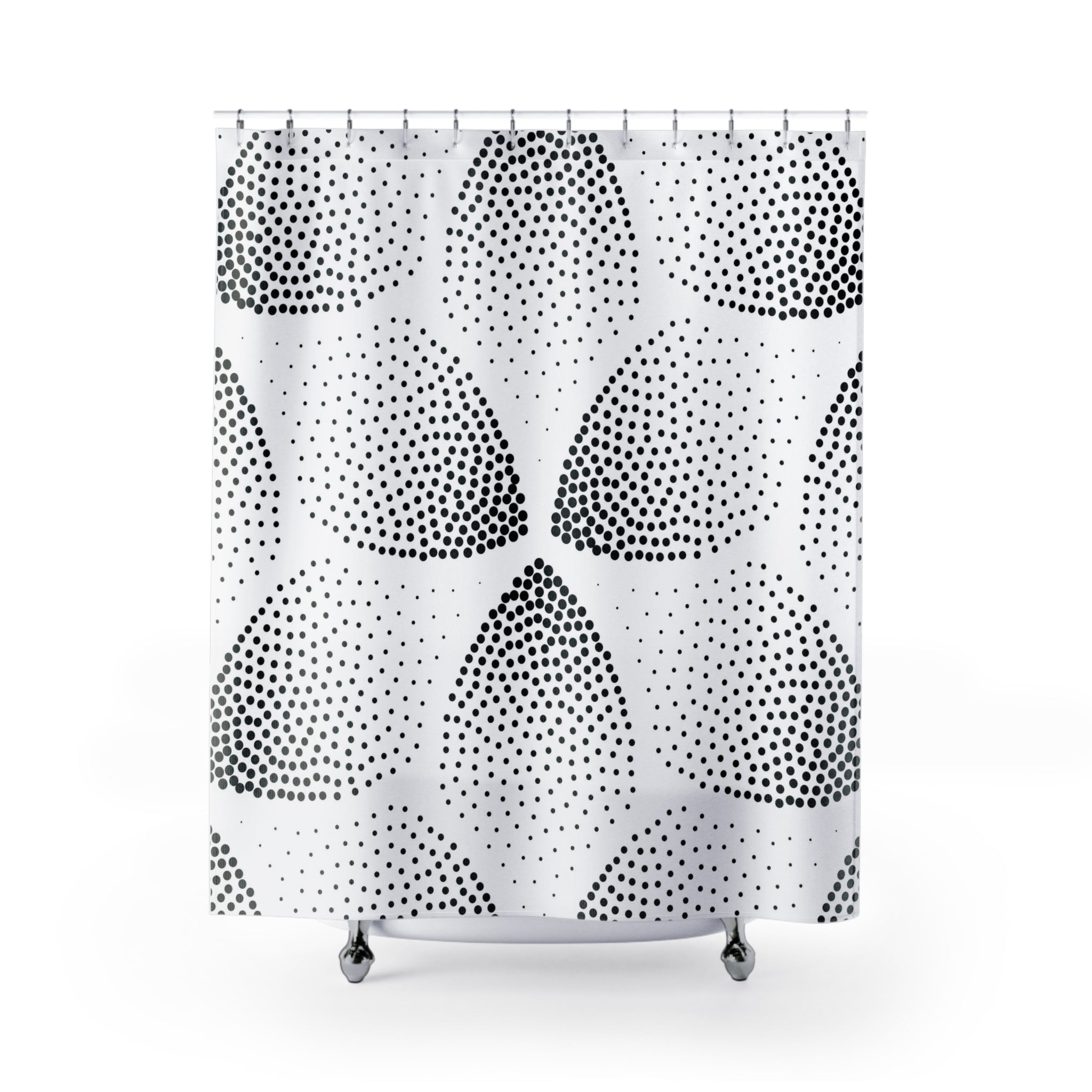 a black and white shower curtain with polka dots