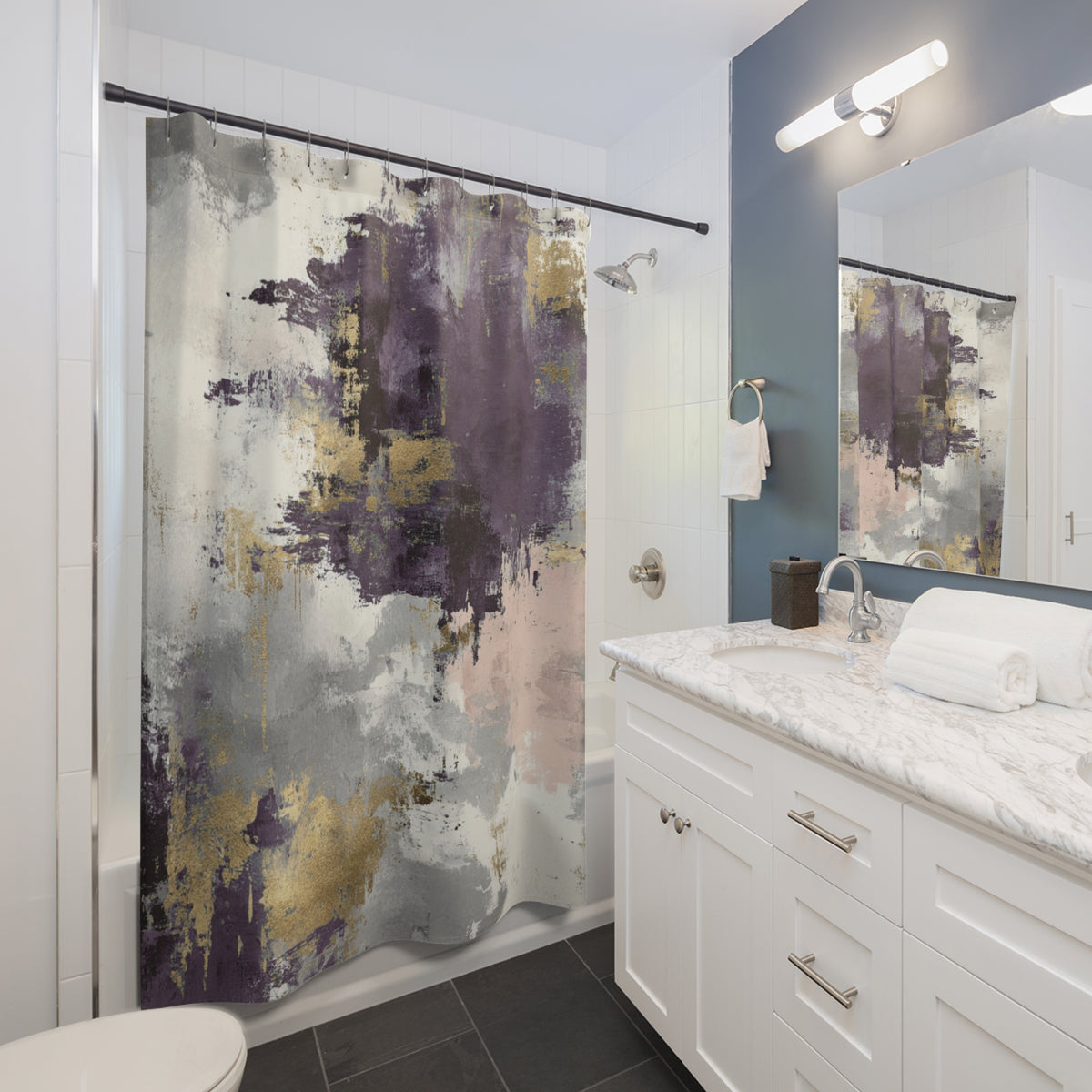 a modern bathroom with a white vanity, a large abstract shower curtain, and a mirror above the vanity.