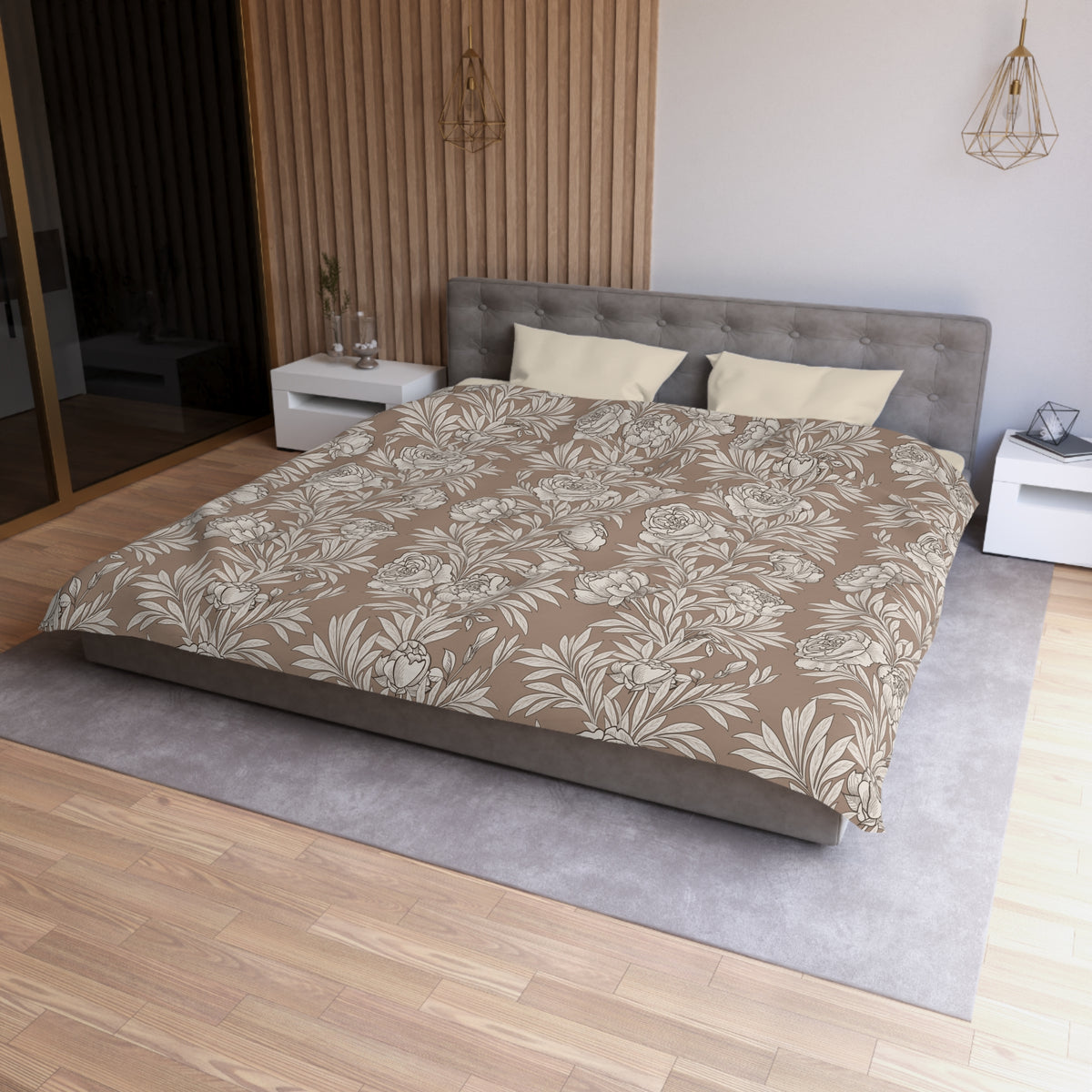 a modern bedroom with a large bed, a gray headboard, and a wooden wall. The bed is covered in a floral print comforter, and there are two pillows on it. The room has a wooden floor and a gray area rug. There are also two nightstands on either side of the bed, and a pendant light hanging above the bed.