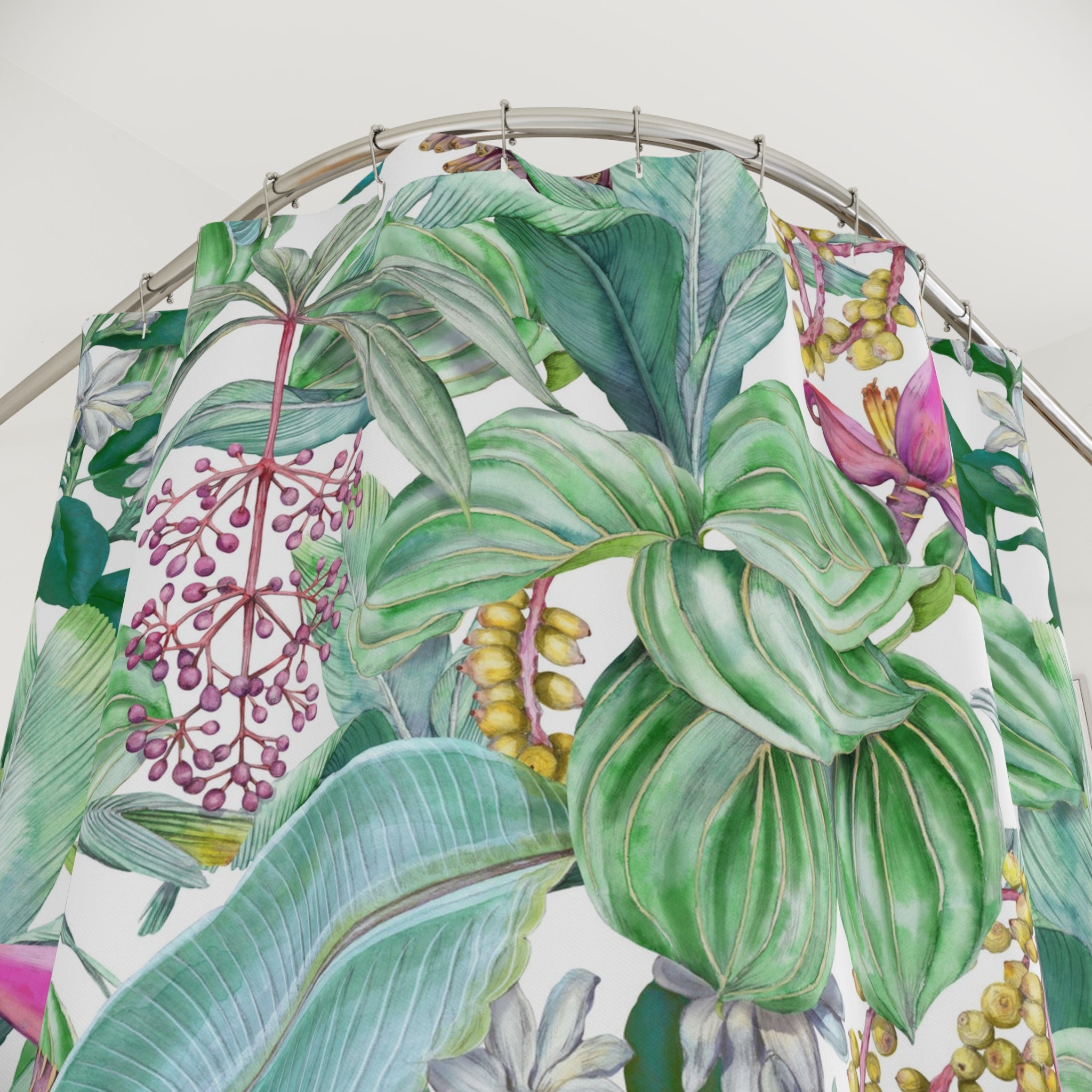 a shower curtain with a vibrant, tropical print of various leaves and flowers in shades of green, pink, and yellow.