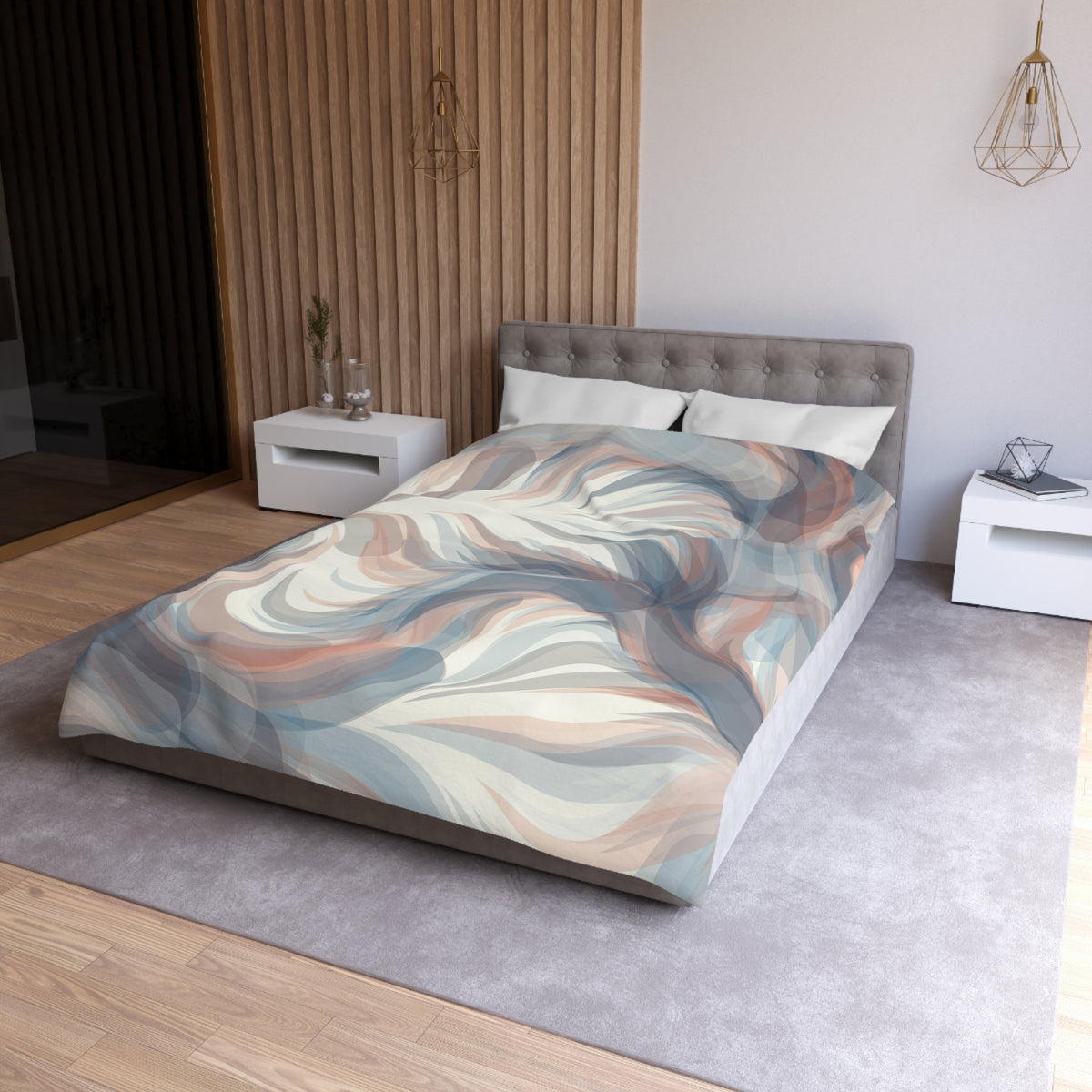 a modern bedroom with a large bed, a gray headboard, and a colorful abstract patterned bedspread. The room has a neutral color scheme with white walls and a wooden floor. There are two nightstands on either side of the bed, and a pendant light hangs above it.