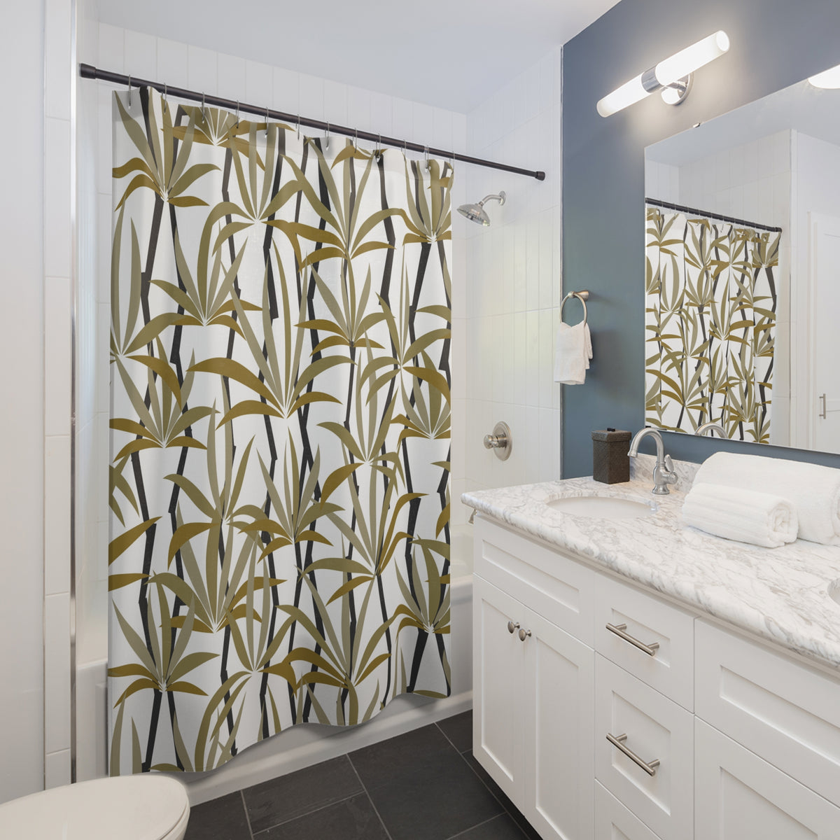 a modern bathroom with a white vanity, a shower curtain with a tropical plant print, and a mirror above the vanity.