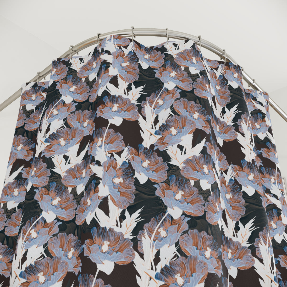 a shower curtain with a floral pattern in shades of blue, brown, and white.