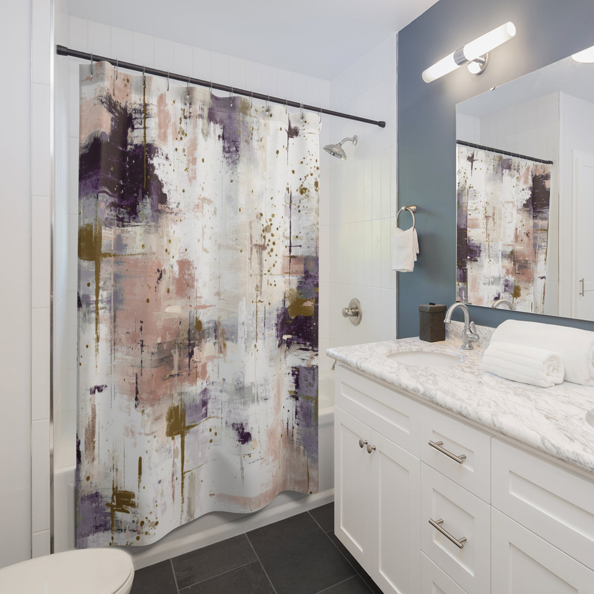 a modern bathroom with a white vanity, a large abstract shower curtain, and a mirror above the vanity.