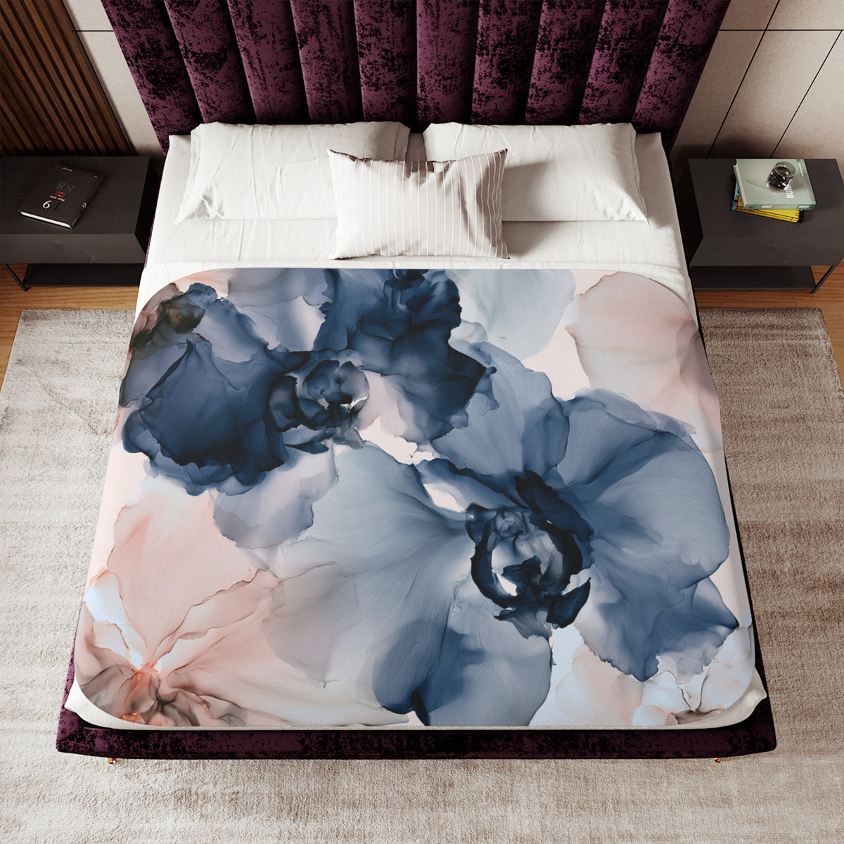 a bed with a purple and blue flower design on it