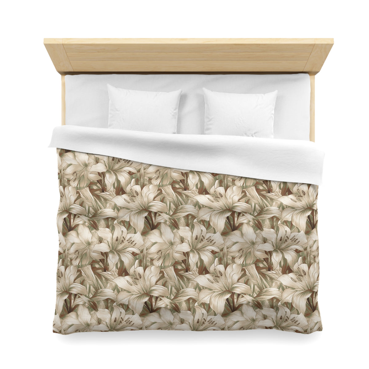 a neatly made bed with a floral print comforter and two white pillows.