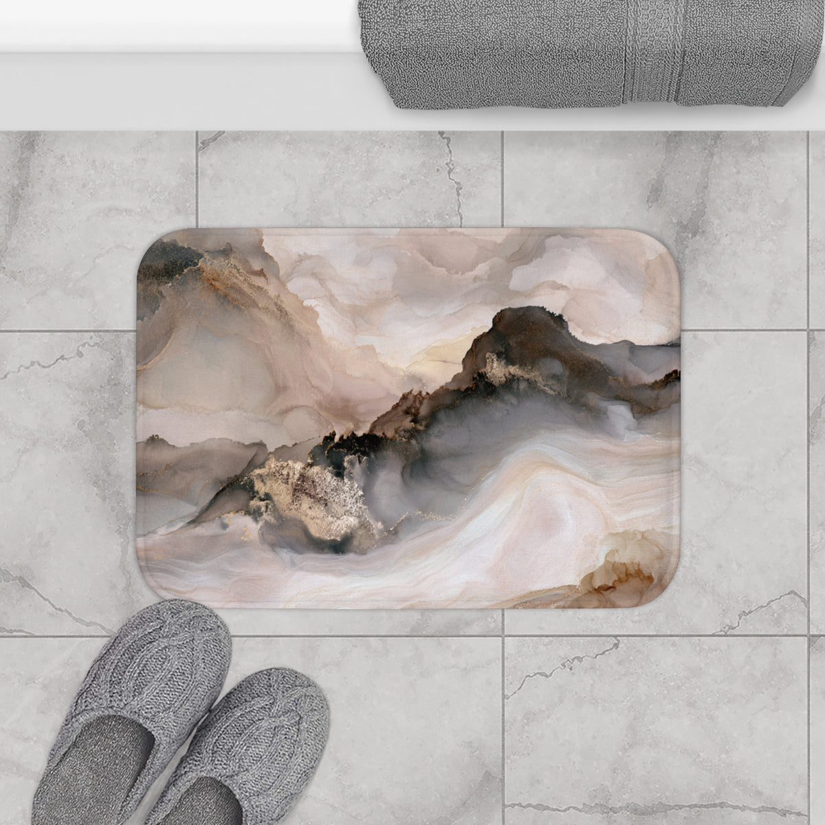 a bathroom floor with a marble-like tile pattern, a pair of gray slippers, and a gray towel rolled up on a shelf.