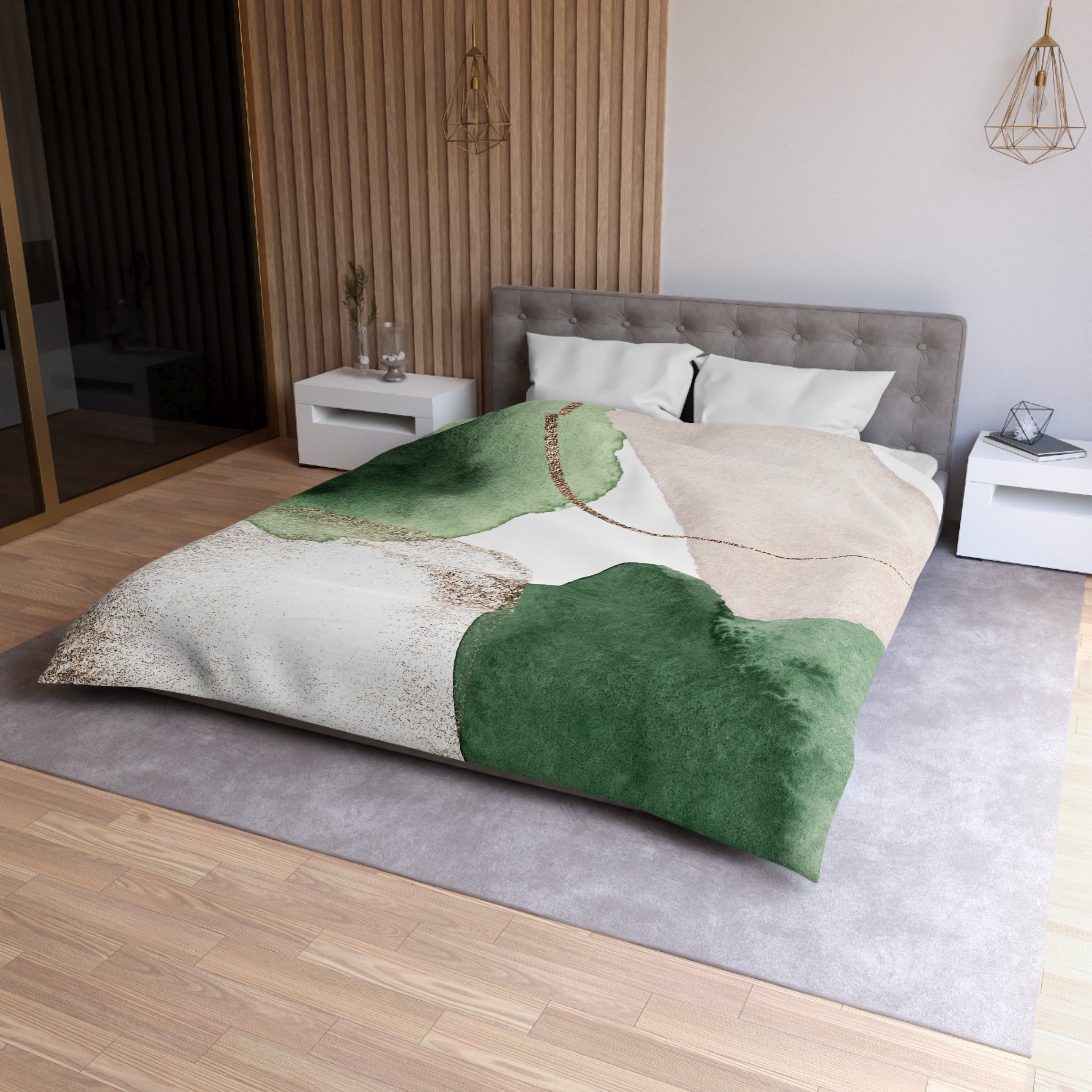 a modern bedroom with a large bed, a gray headboard, and a green and white patterned comforter. The room has a wooden floor and white walls, creating a clean and minimalist aesthetic.