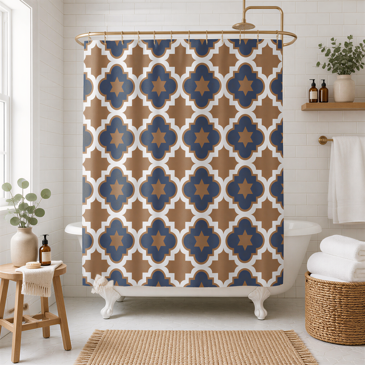 Navy and camel tan Moroccan quatrefoil shower curtain over a clawfoot tub in a white tiled bathroom