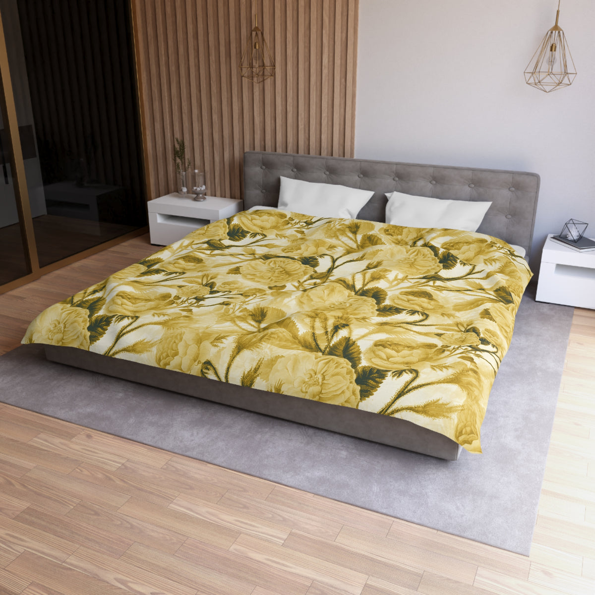 a modern bedroom with a large bed covered in a yellow floral comforter. The bed is positioned against a wall with a wooden paneling. The room also features a nightstand, a pendant light, and a mirror.