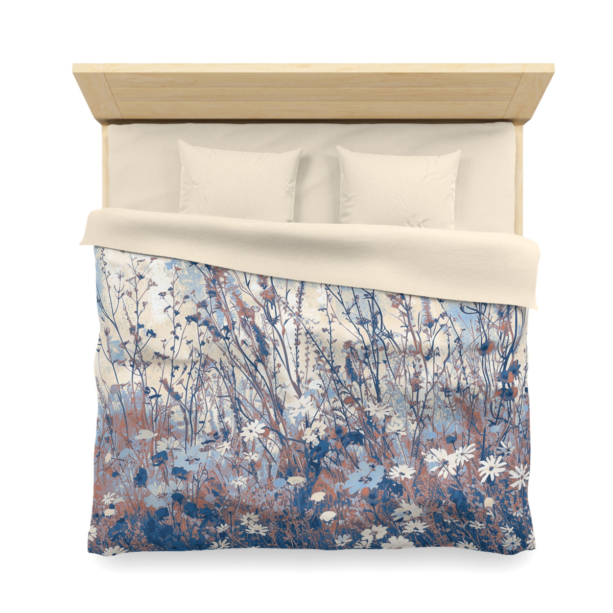 a neatly made bed with a floral patterned comforter and pillows.