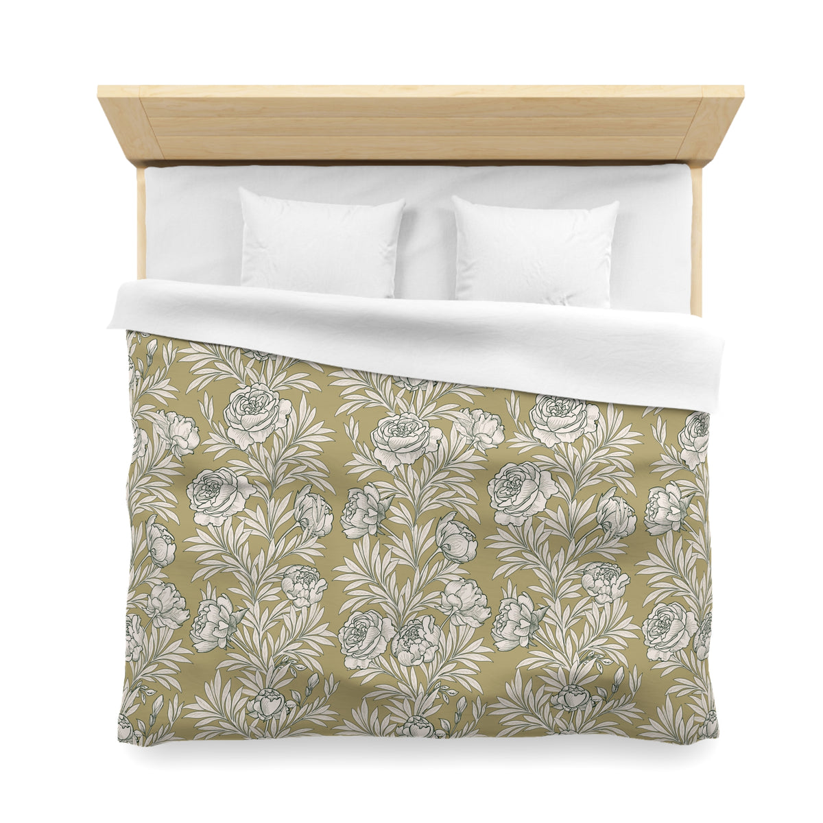 a neatly made bed with a floral print comforter and two white pillows.