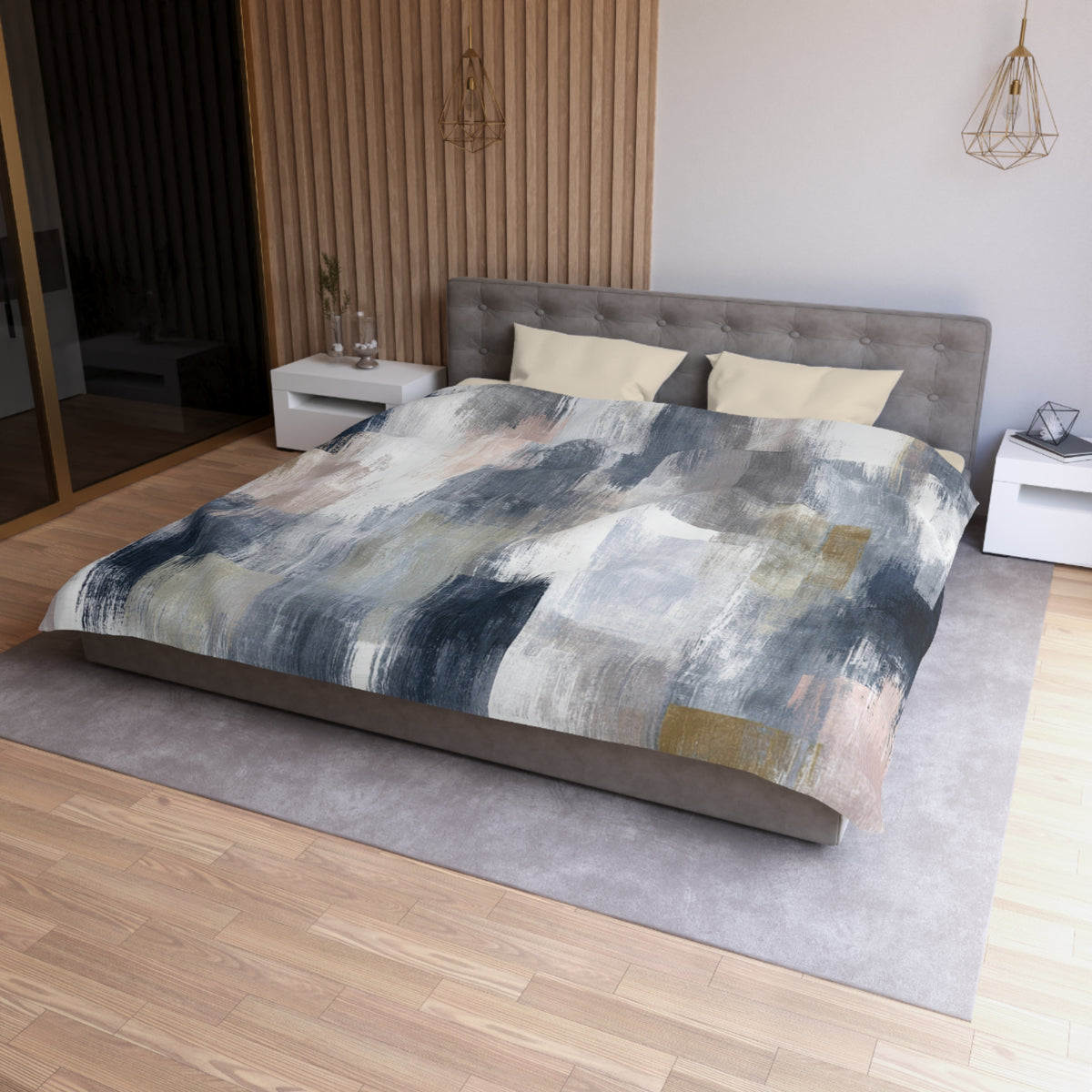 a modern bedroom with a large bed, a gray headboard, and a wooden floor. The bed is covered with a colorful abstract patterned comforter.