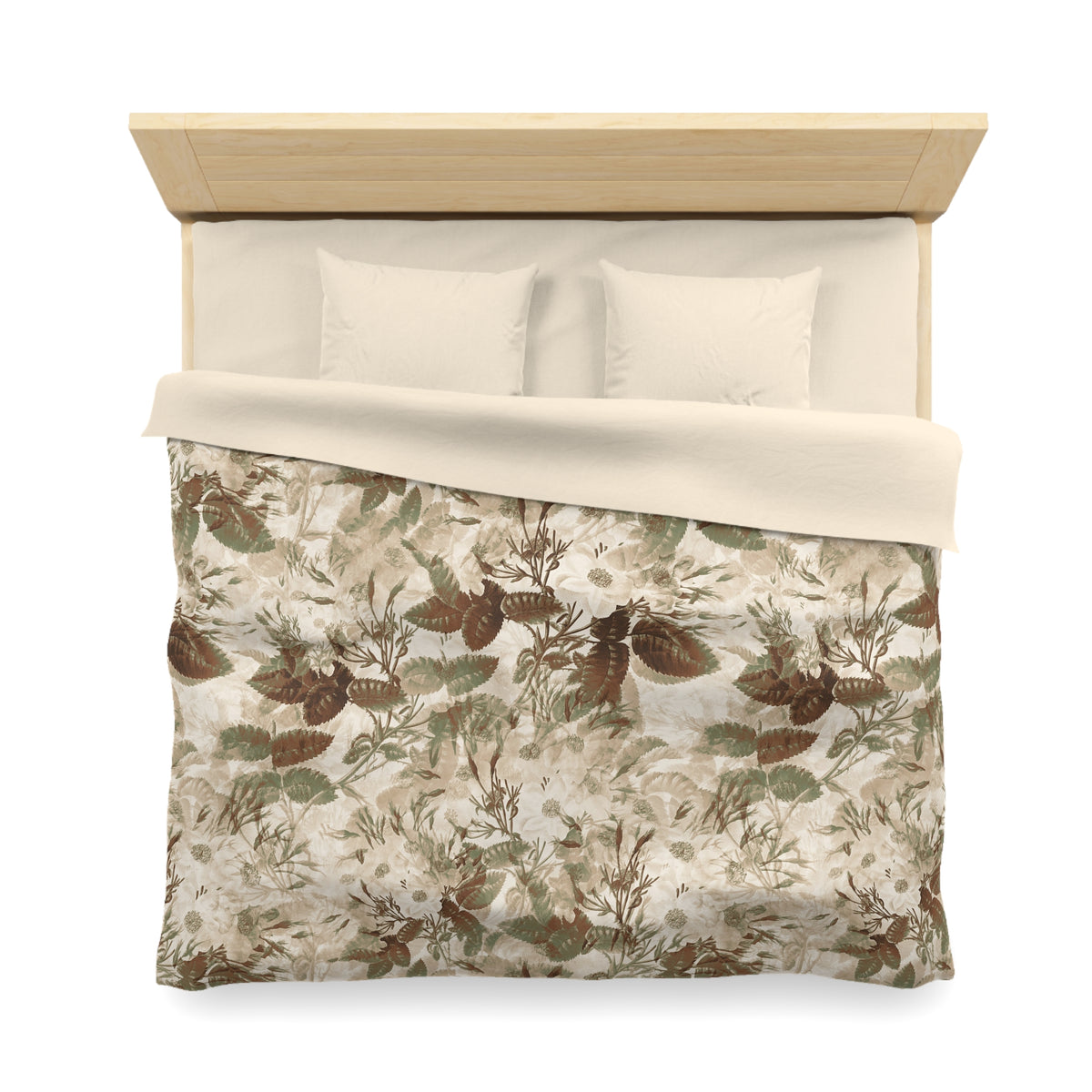 a neatly made bed with a floral print comforter and two pillows.