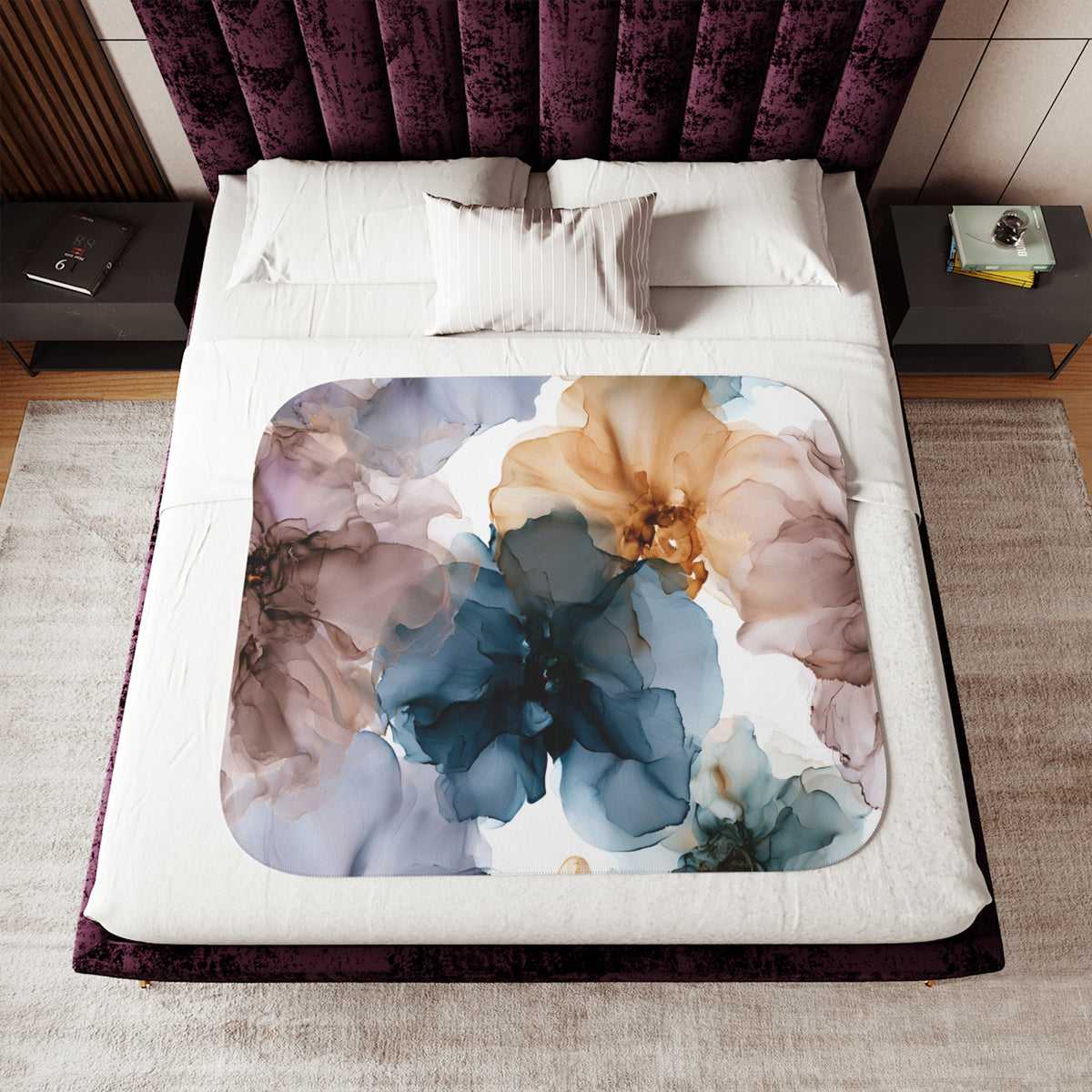 a bed with a floral comforter and pillows