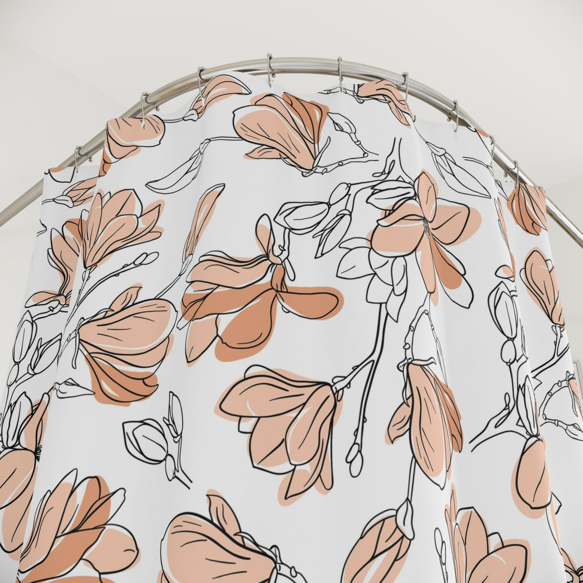 a shower curtain with a floral pattern of orange and white flowers.