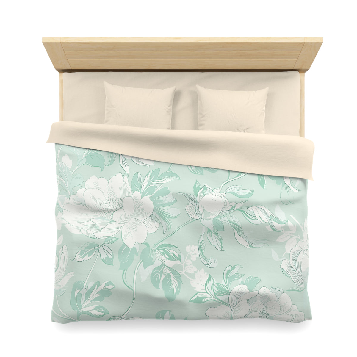 a neatly made bed with a floral patterned comforter and pillows.
