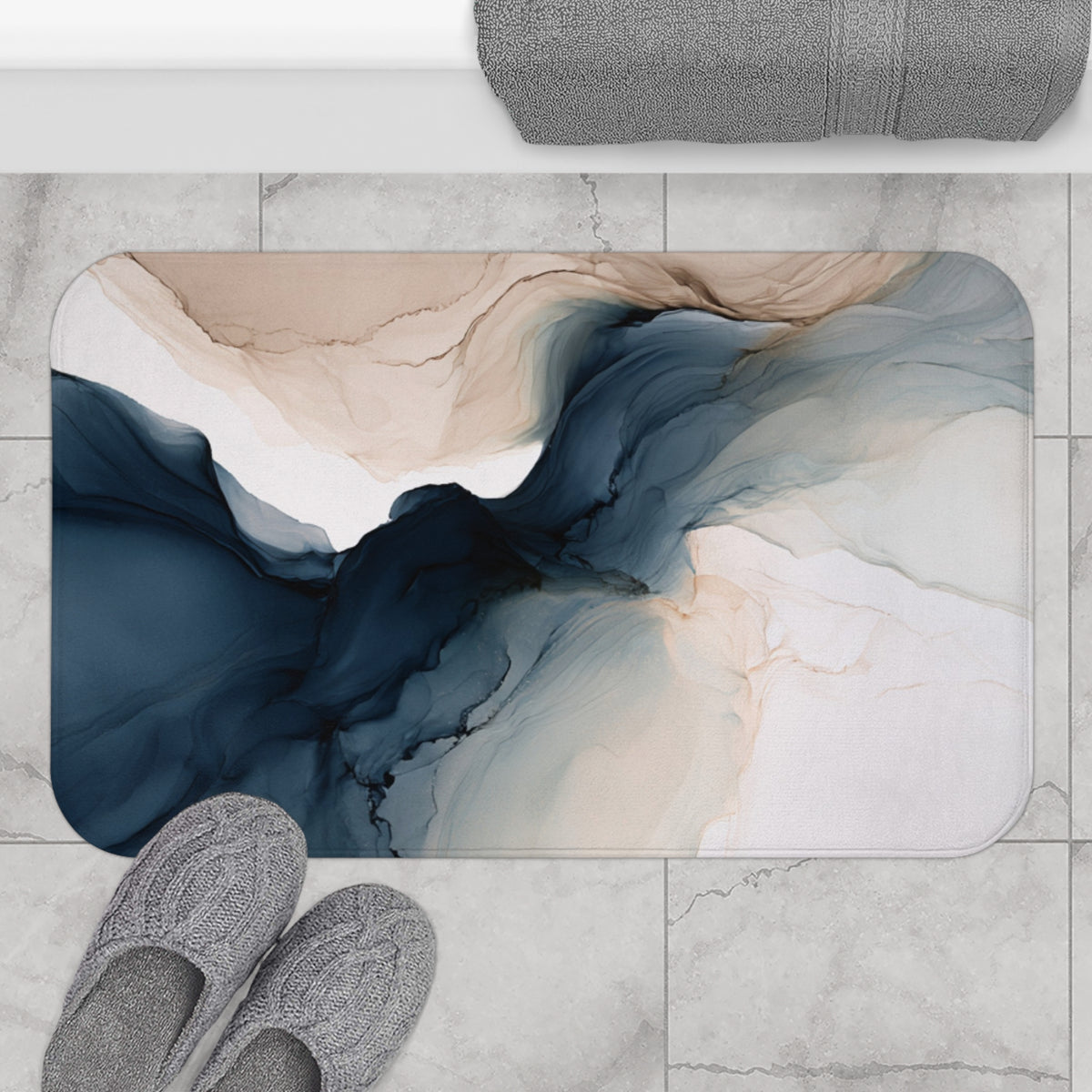 a bathroom rug with a pair of slippers next to it