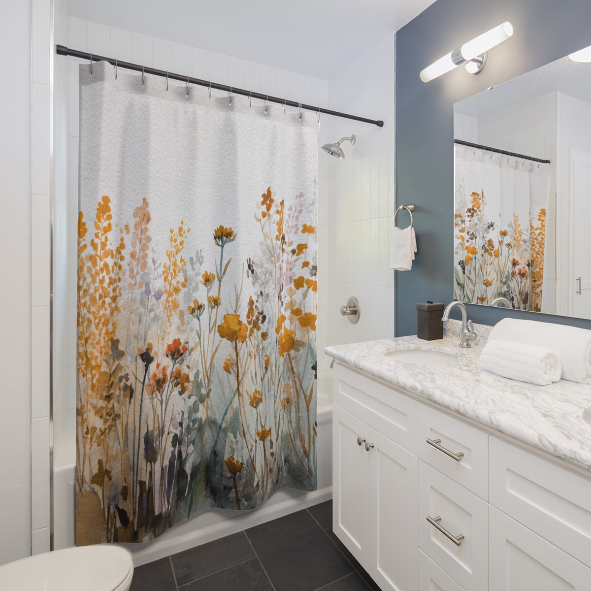 a modern bathroom with a white vanity, a shower curtain featuring a floral pattern, and a mirror above the vanity.