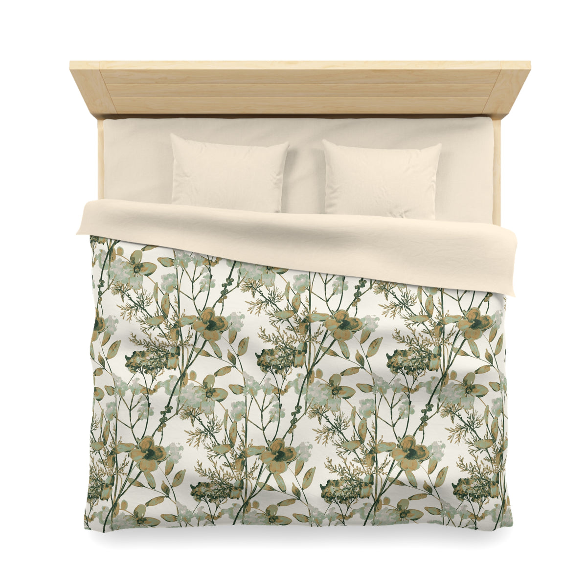 a neatly made bed with a floral print comforter and pillows.