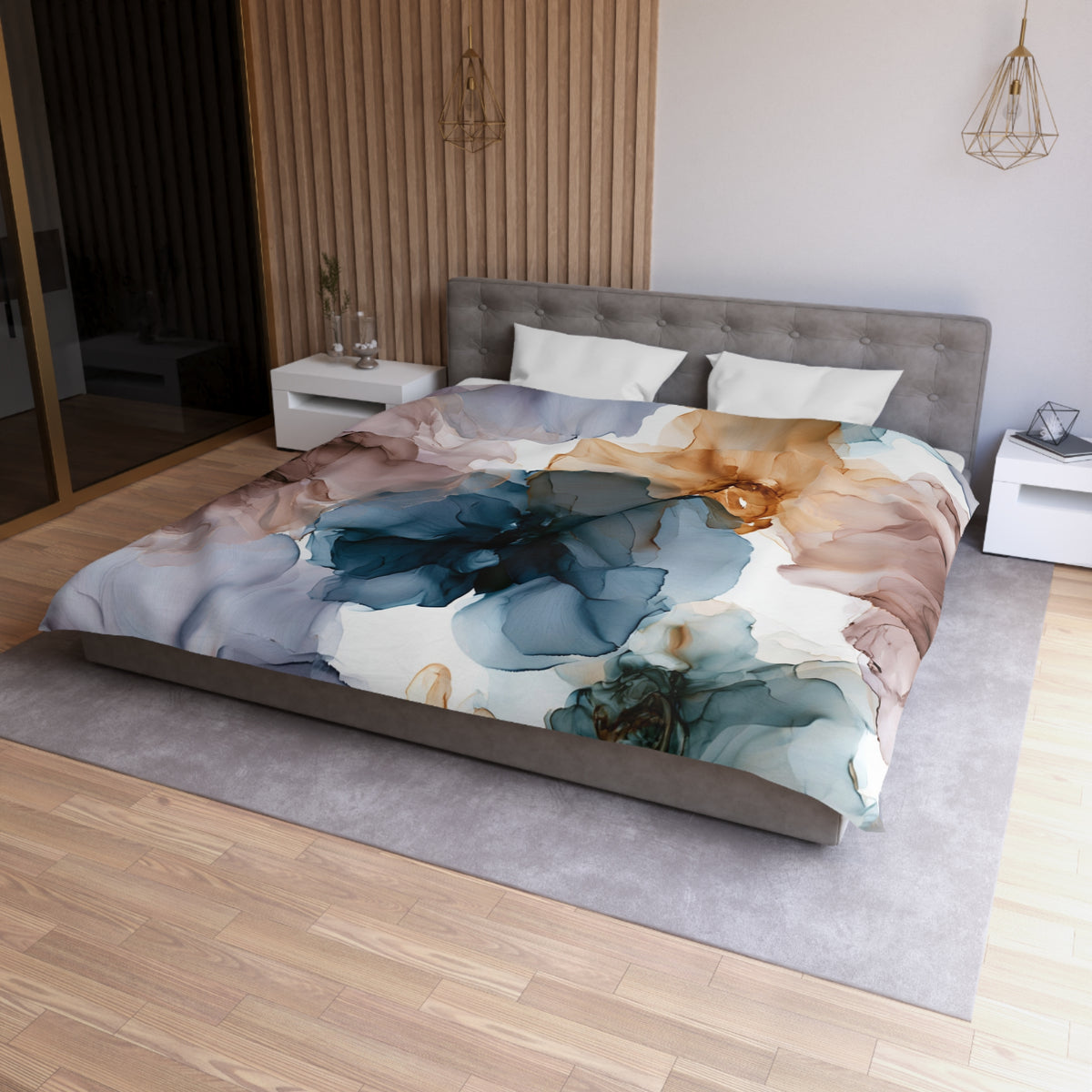 a bed with a floral comforter on top of it