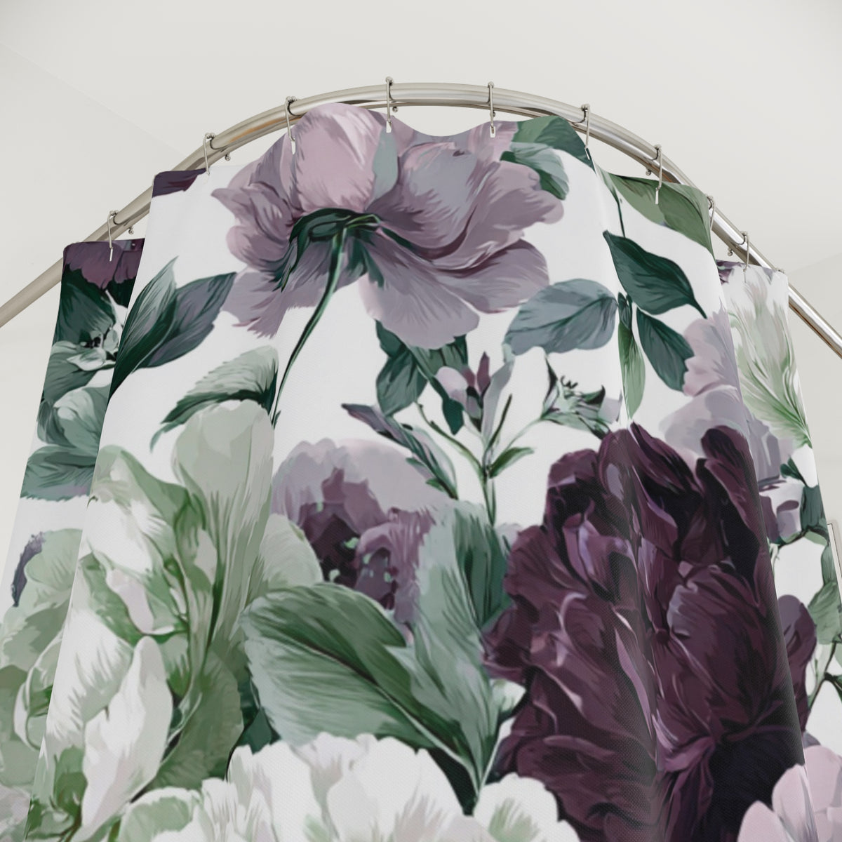 a shower curtain with a floral pattern of purple and green flowers.