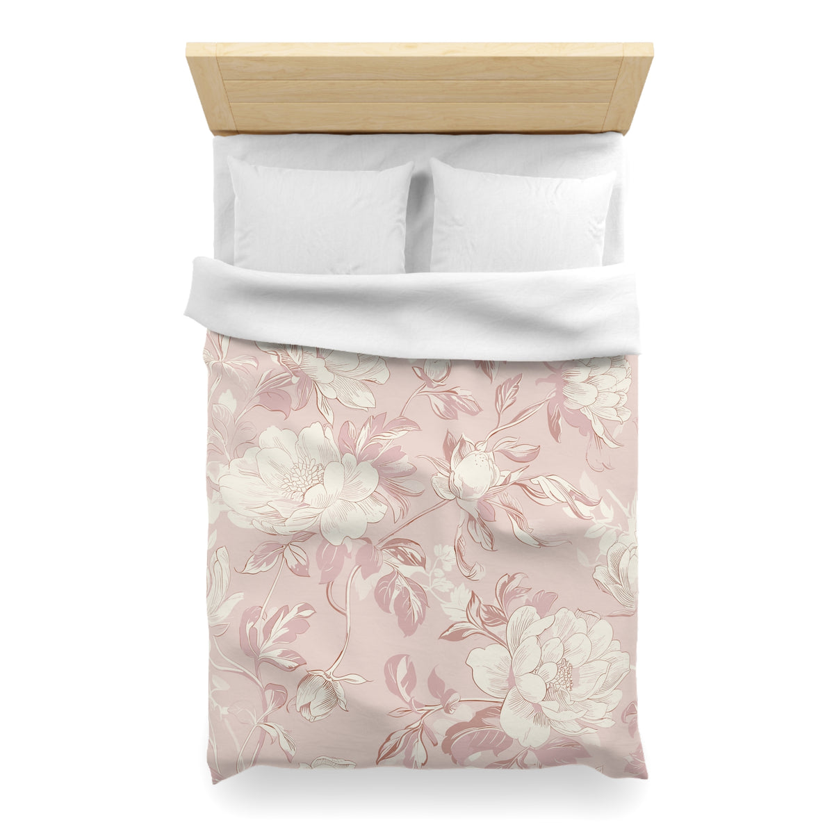 a neatly made bed with a floral patterned comforter and pillows.