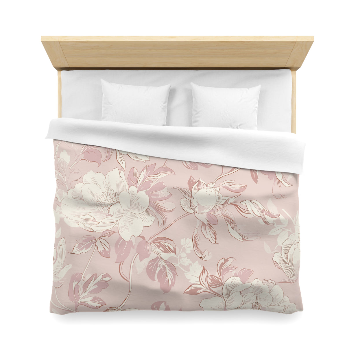 a neatly made bed with a floral patterned comforter and pillows.