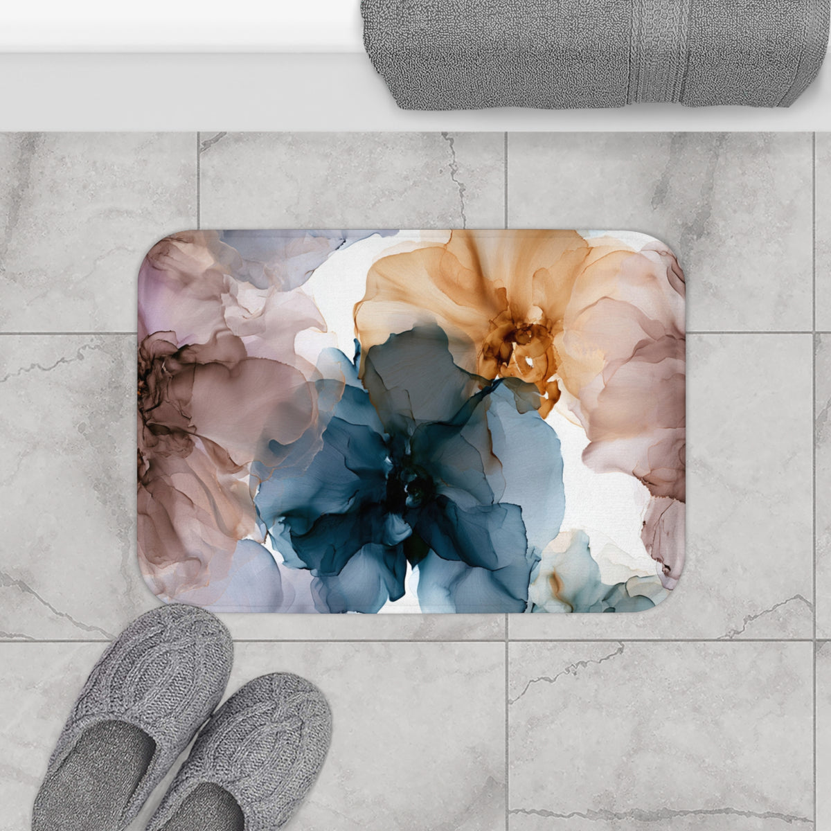 a bathroom rug with a flower design on it