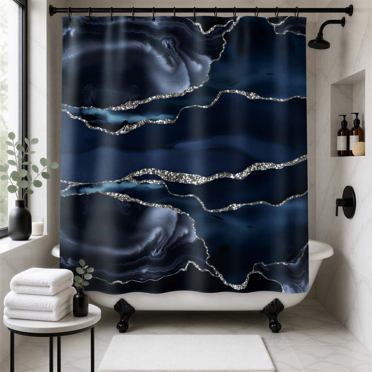 a bathroom with a white bathtub, a black shower curtain with a striking blue and silver marble pattern, and a small table with a plant and a bottle of soap.