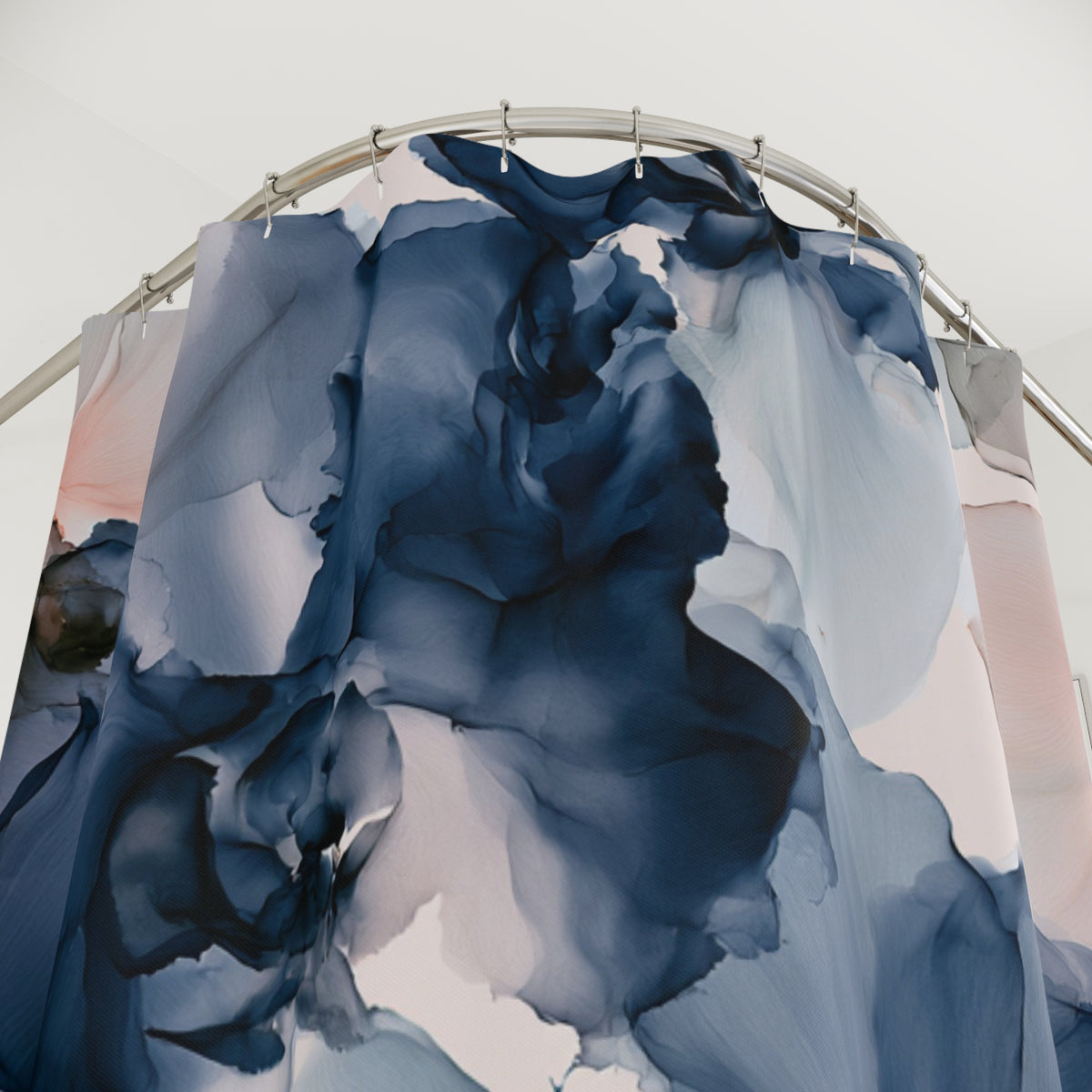 a shower curtain with blue and pink paint on it