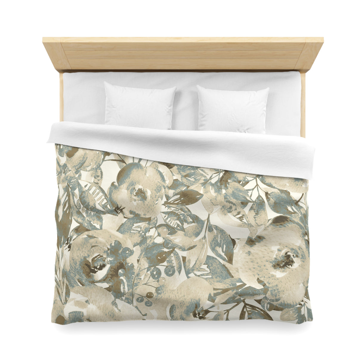 a neatly made bed with a floral print duvet cover and two white pillows.