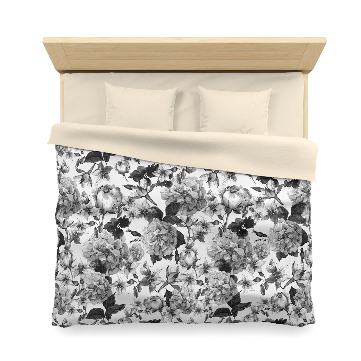 a neatly made bed with a floral print comforter and pillows.