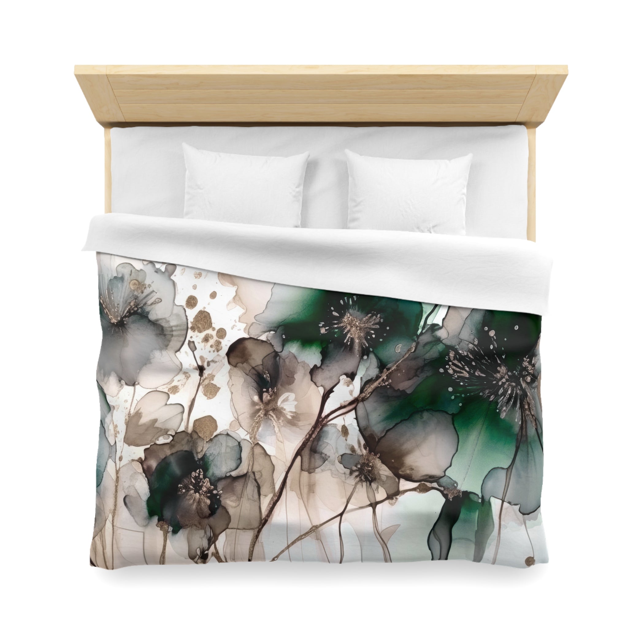 a bed with a white comforter and a decorative floral print on the duvet cover.