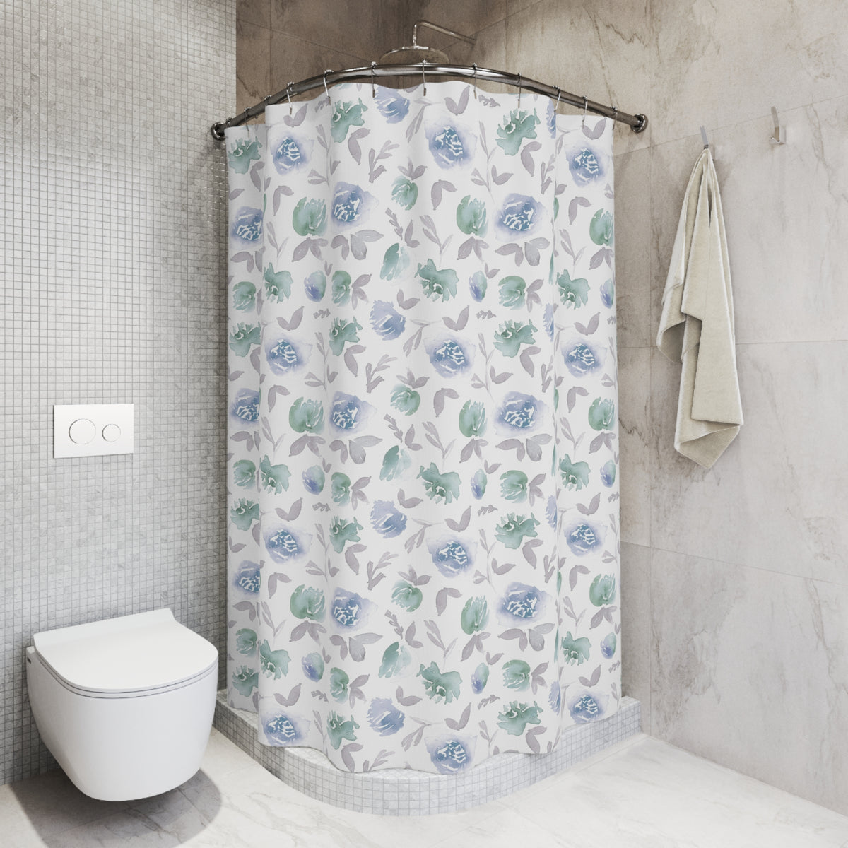a bathroom with a shower curtain featuring a floral pattern in shades of blue and green. The shower area is located next to a toilet, and there is a towel hanging on the wall.