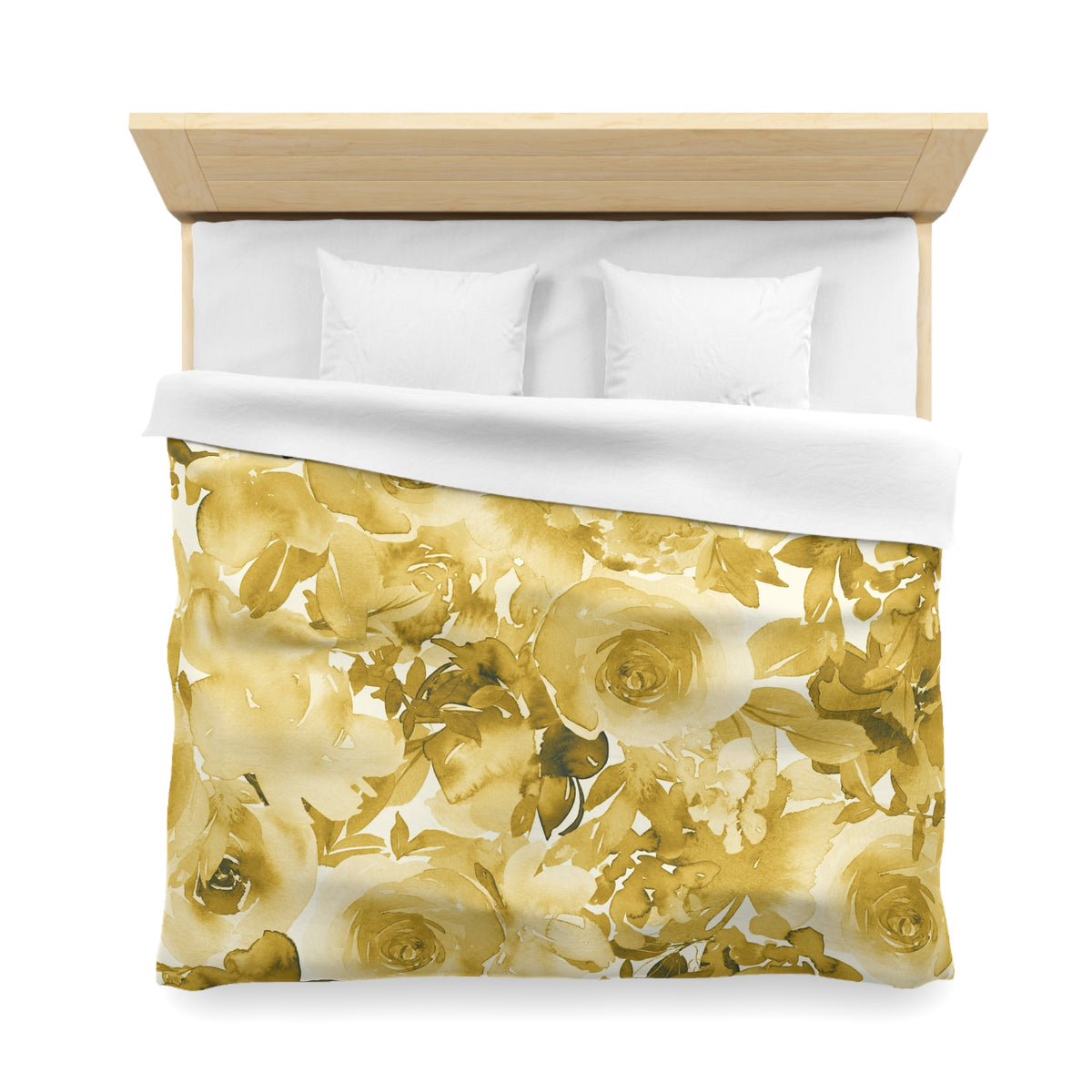 a bed with a floral print duvet cover and white pillows.