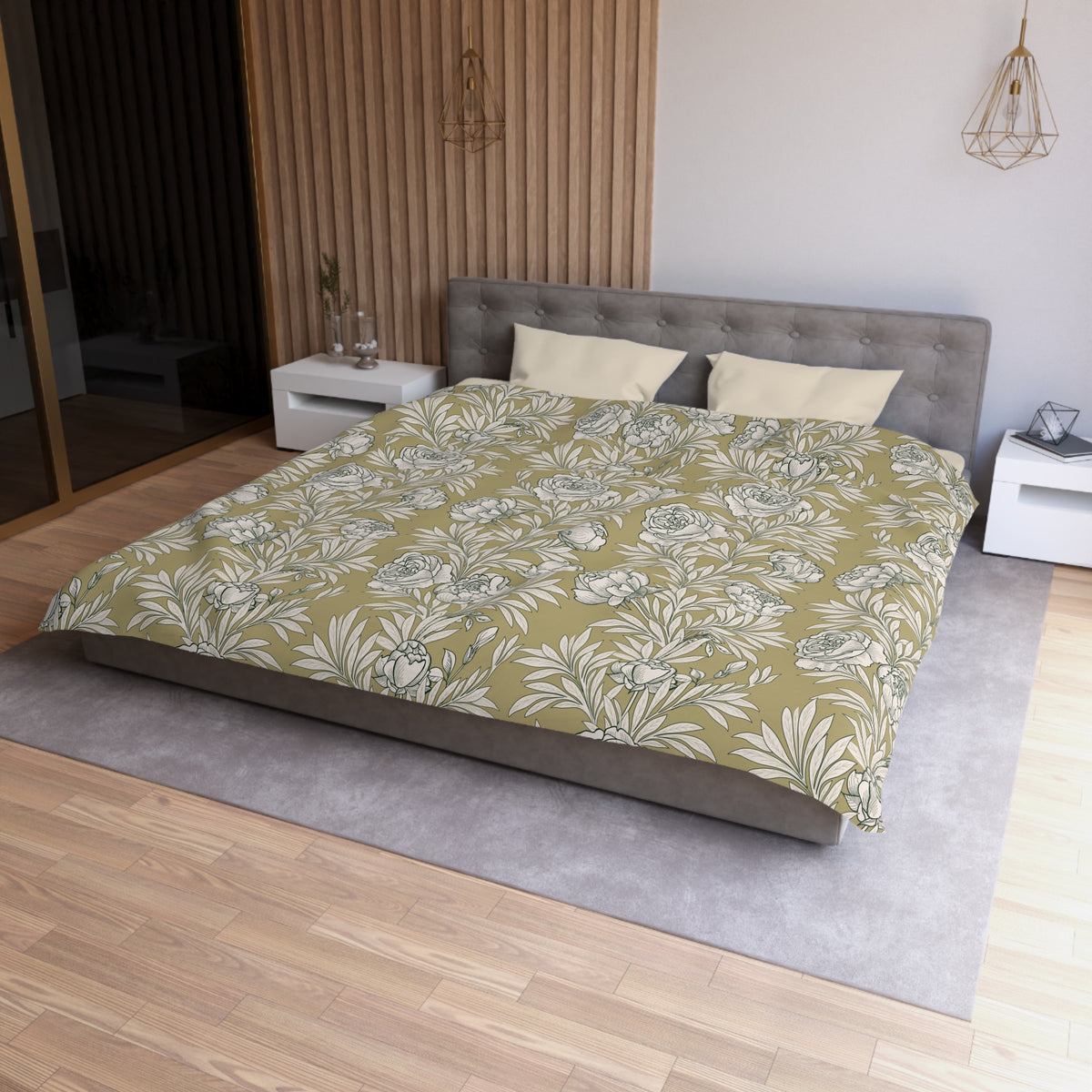 a modern bedroom with a large bed, a gray headboard, and a floral patterned comforter. The room has a wooden floor and white walls, creating a serene and elegant atmosphere.