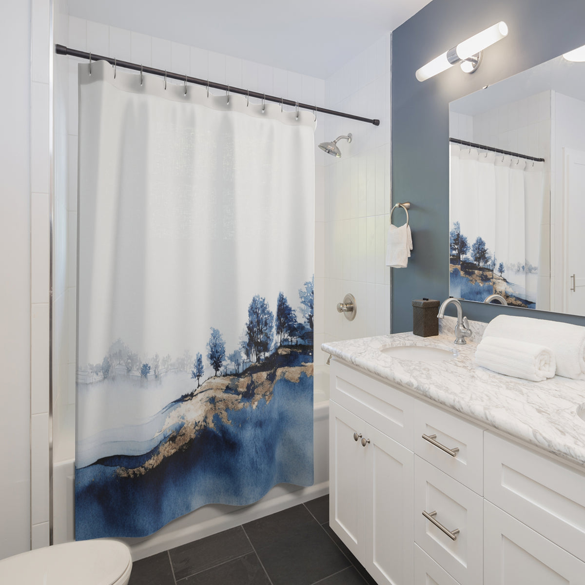 a modern bathroom with a white vanity, a shower curtain featuring a blue landscape design, and a mirror above the vanity.
