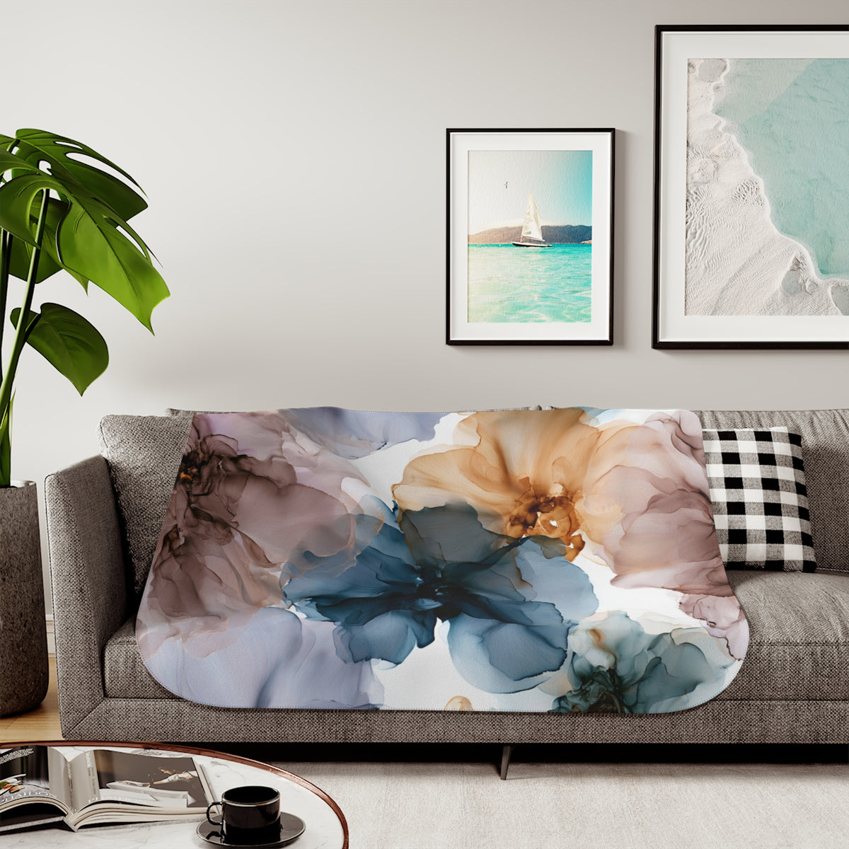 a living room with a couch, coffee table and pictures on the wall