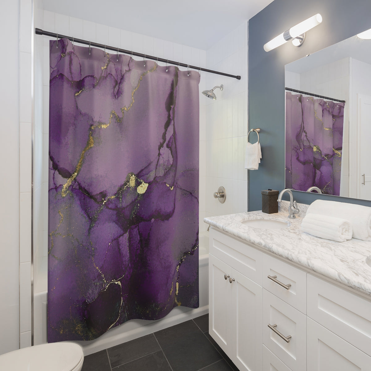 a modern bathroom with a white vanity, a shower curtain with a purple and gold marble pattern, and a mirror above the vanity.