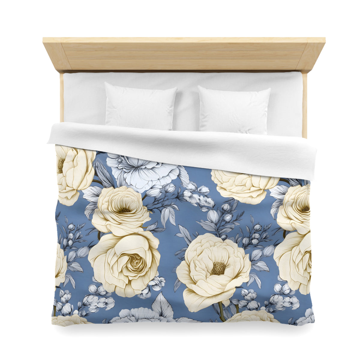 a bed with a floral patterned comforter and pillows.