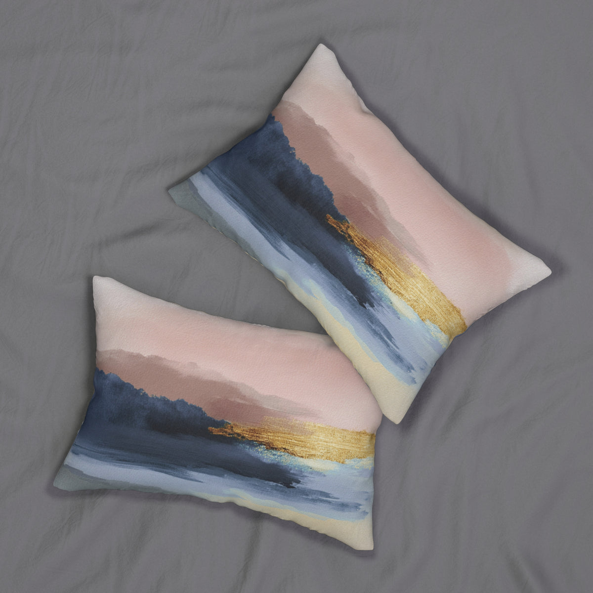 two decorative pillows with a colorful abstract design, resting on a grey fabric surface.