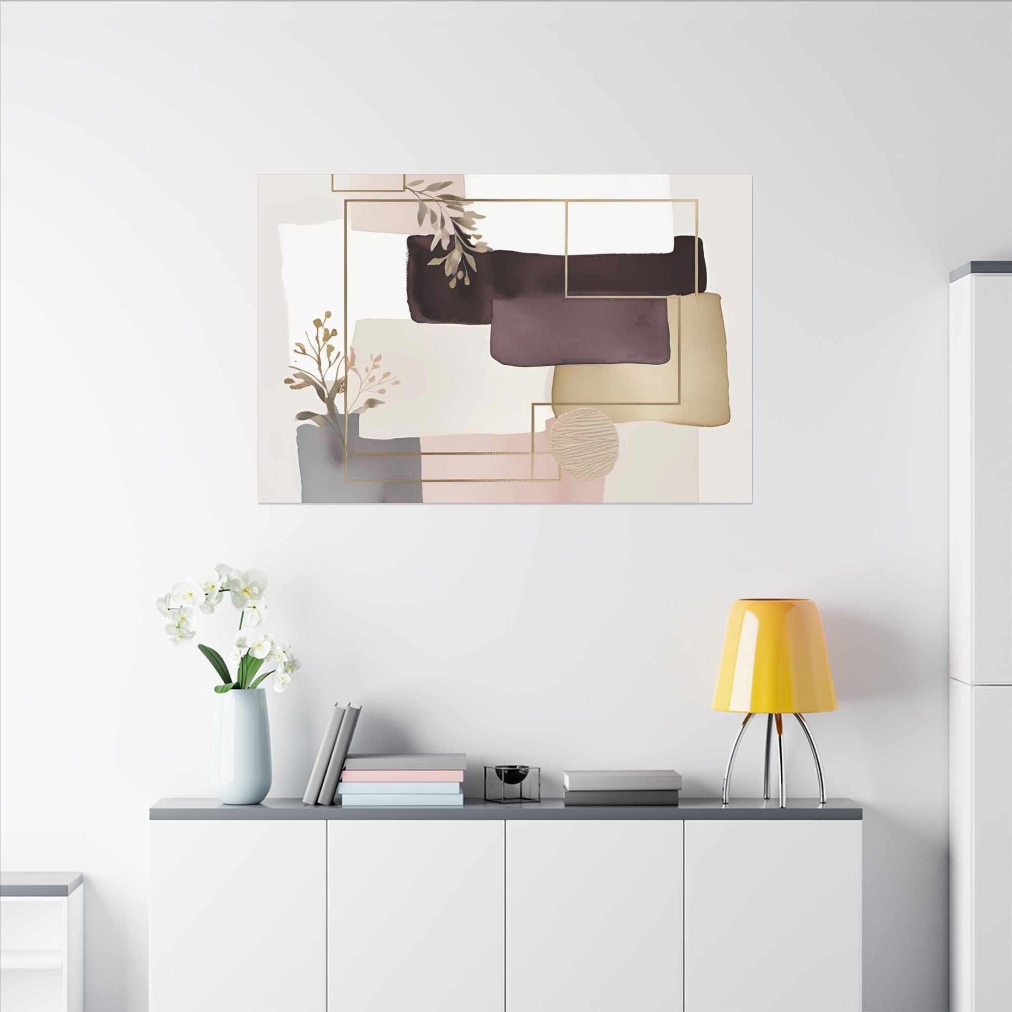 a minimalist living space with a white wall, a white cabinet, and a painting above it. The painting is abstract and includes elements such as a vase with flowers and geometric shapes. The cabinet has a lamp and some books on it, and there is a vase with white flowers on the shelf.