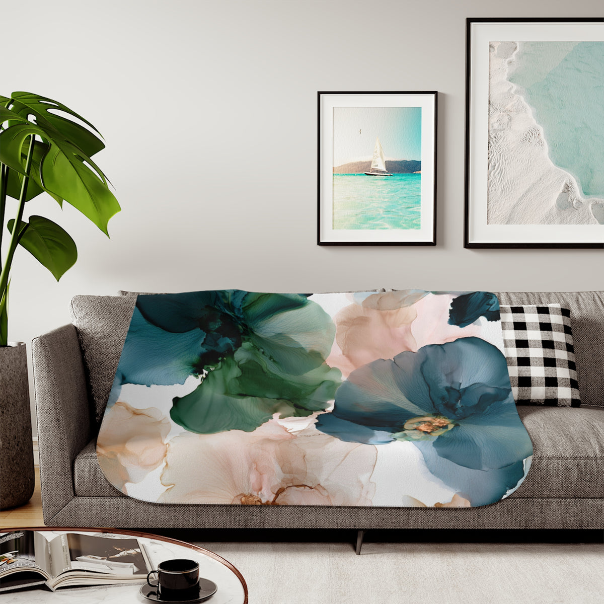a living room with a couch, coffee table and pictures on the wall