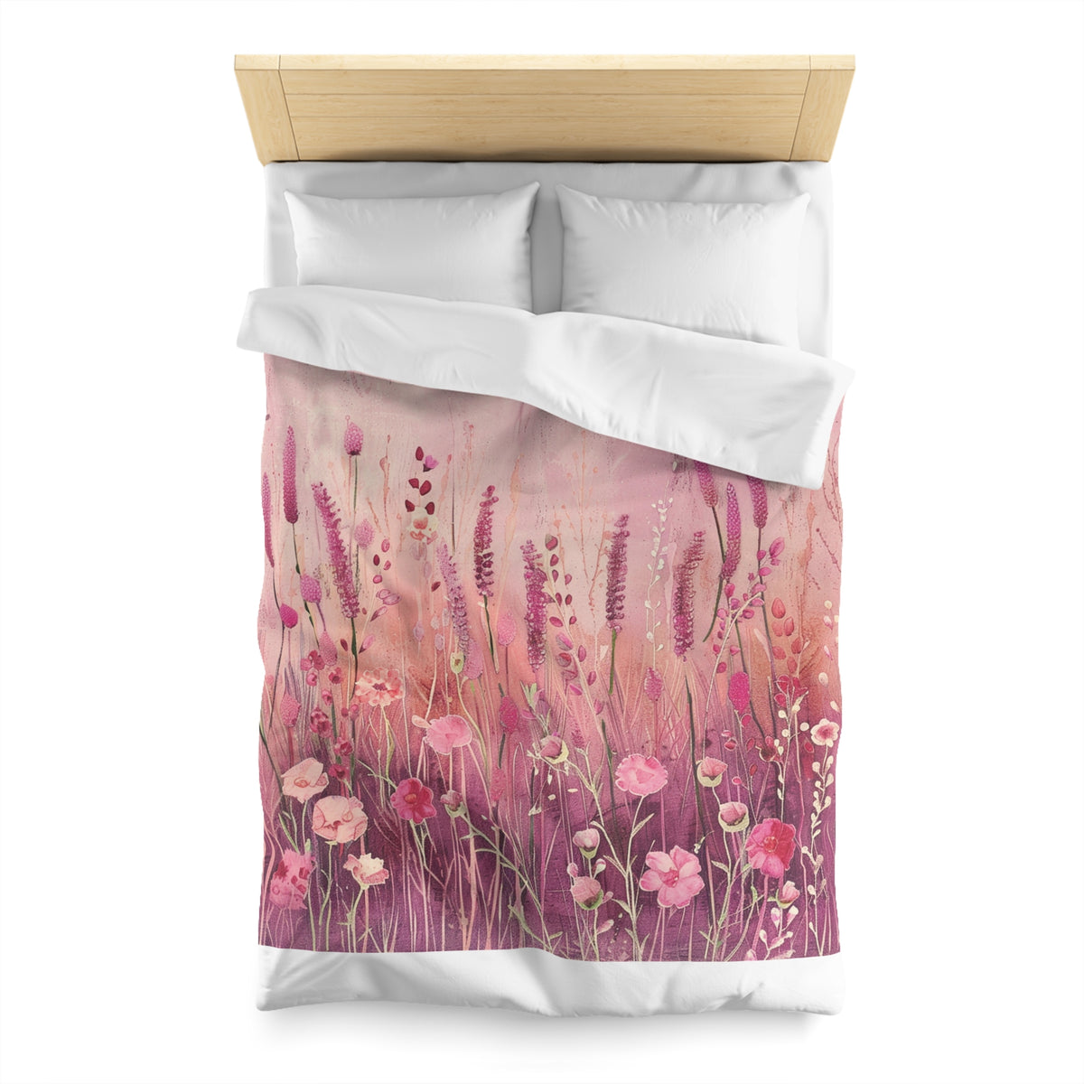 a bed with a floral print duvet cover featuring a field of pink flowers and purple flowers.
