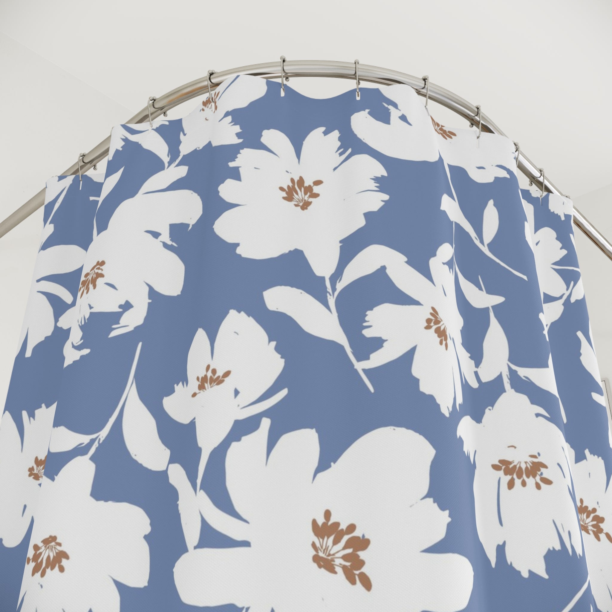 a shower curtain with a blue and white floral pattern.