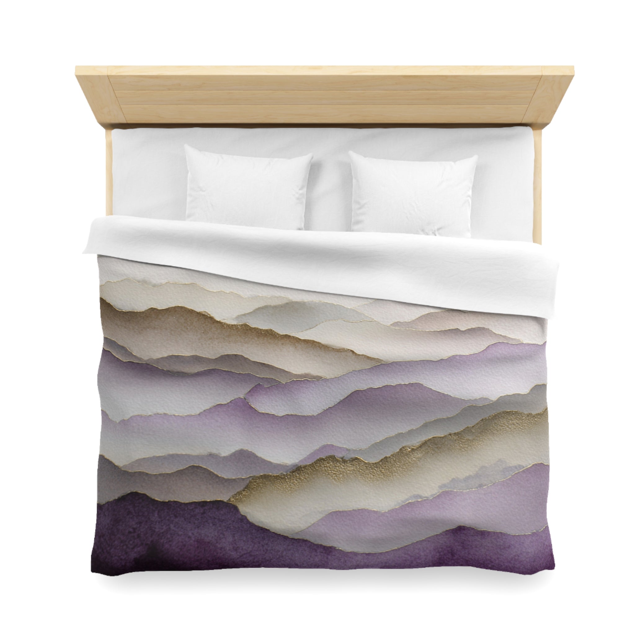 a neatly made bed with a white comforter and pillows. The bed has a wooden headboard and a colorful, abstract patterned comforter featuring a gradient of purple and gray colors.