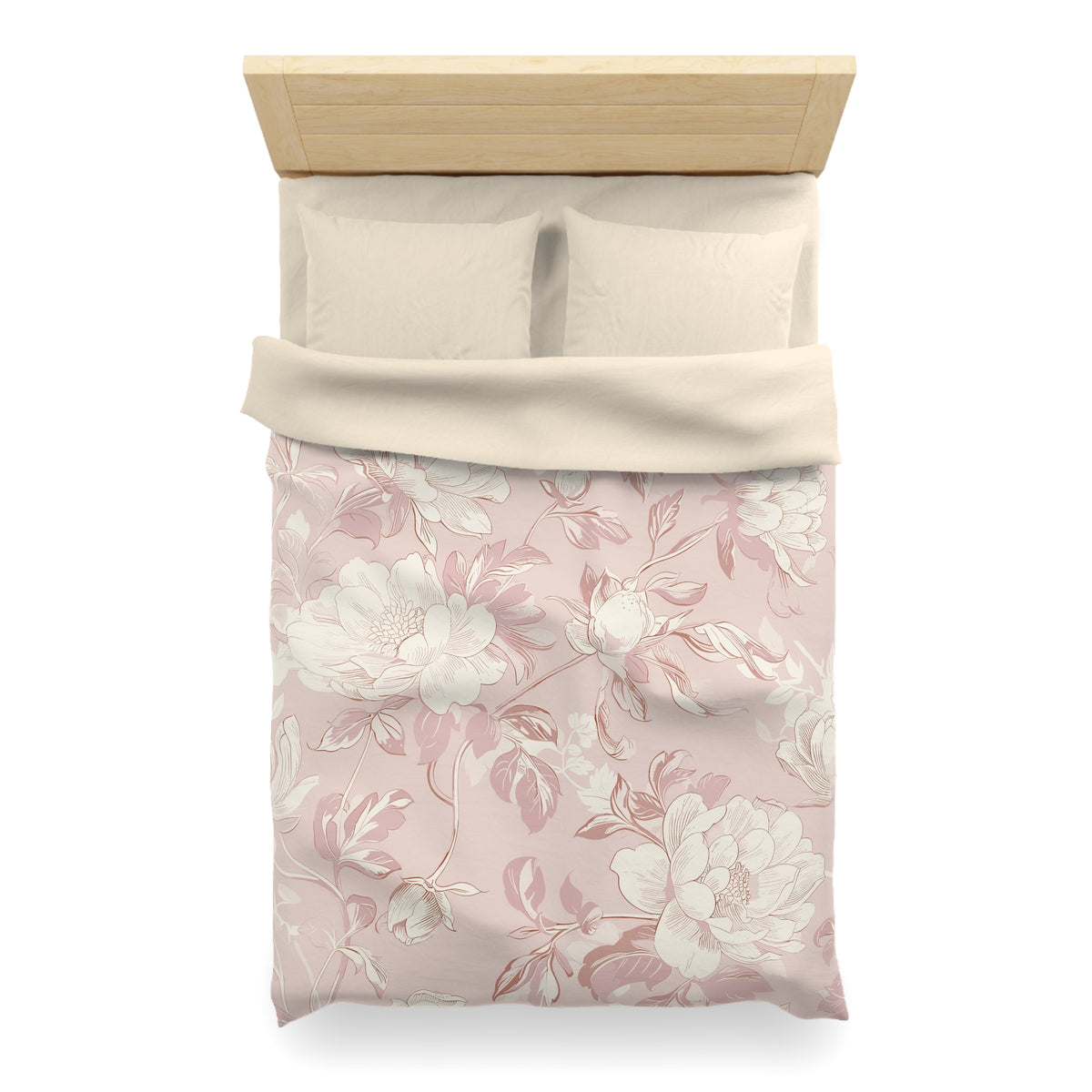 a neatly made bed with a floral patterned comforter and pillows.