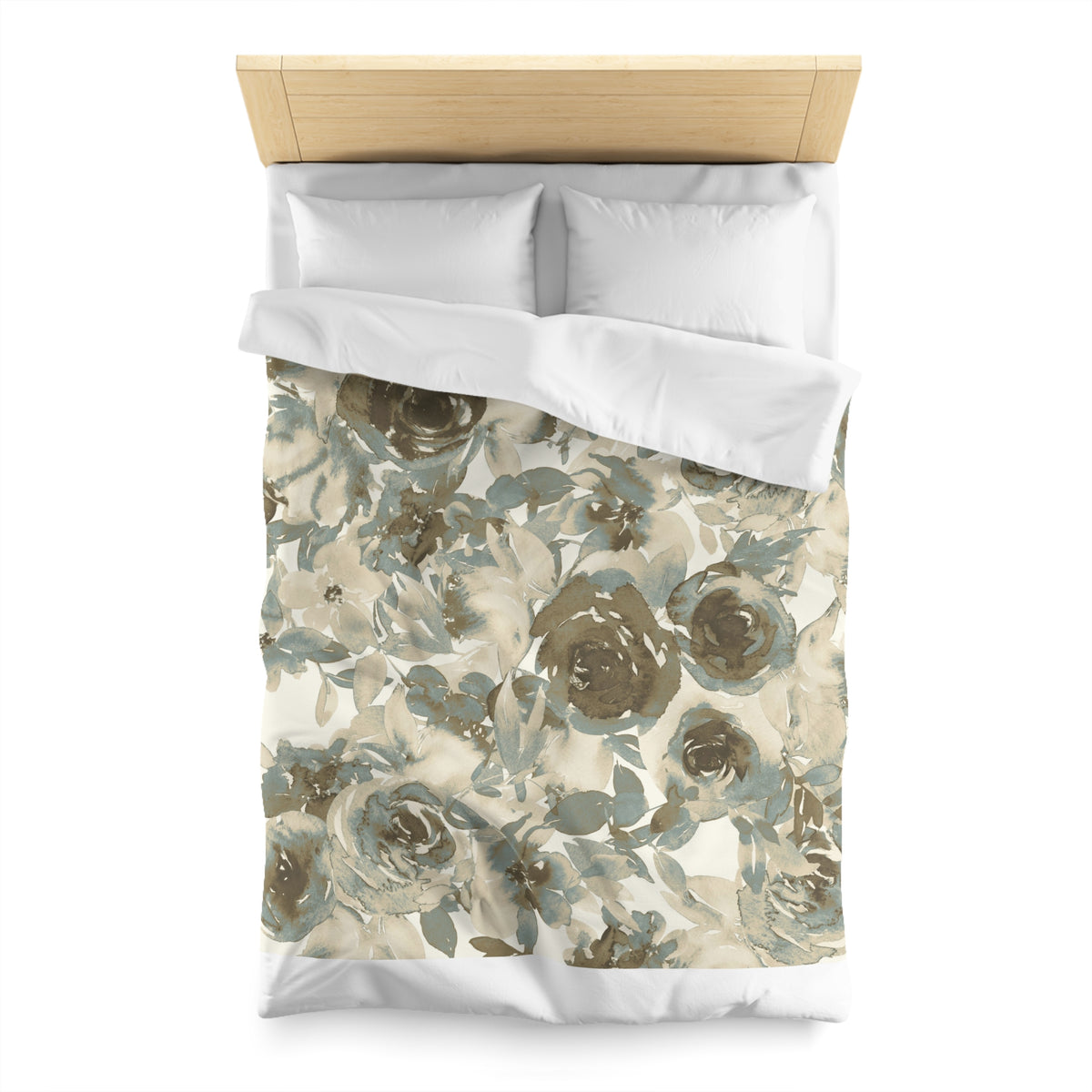a neatly made bed with a floral print duvet cover and two white pillows.
