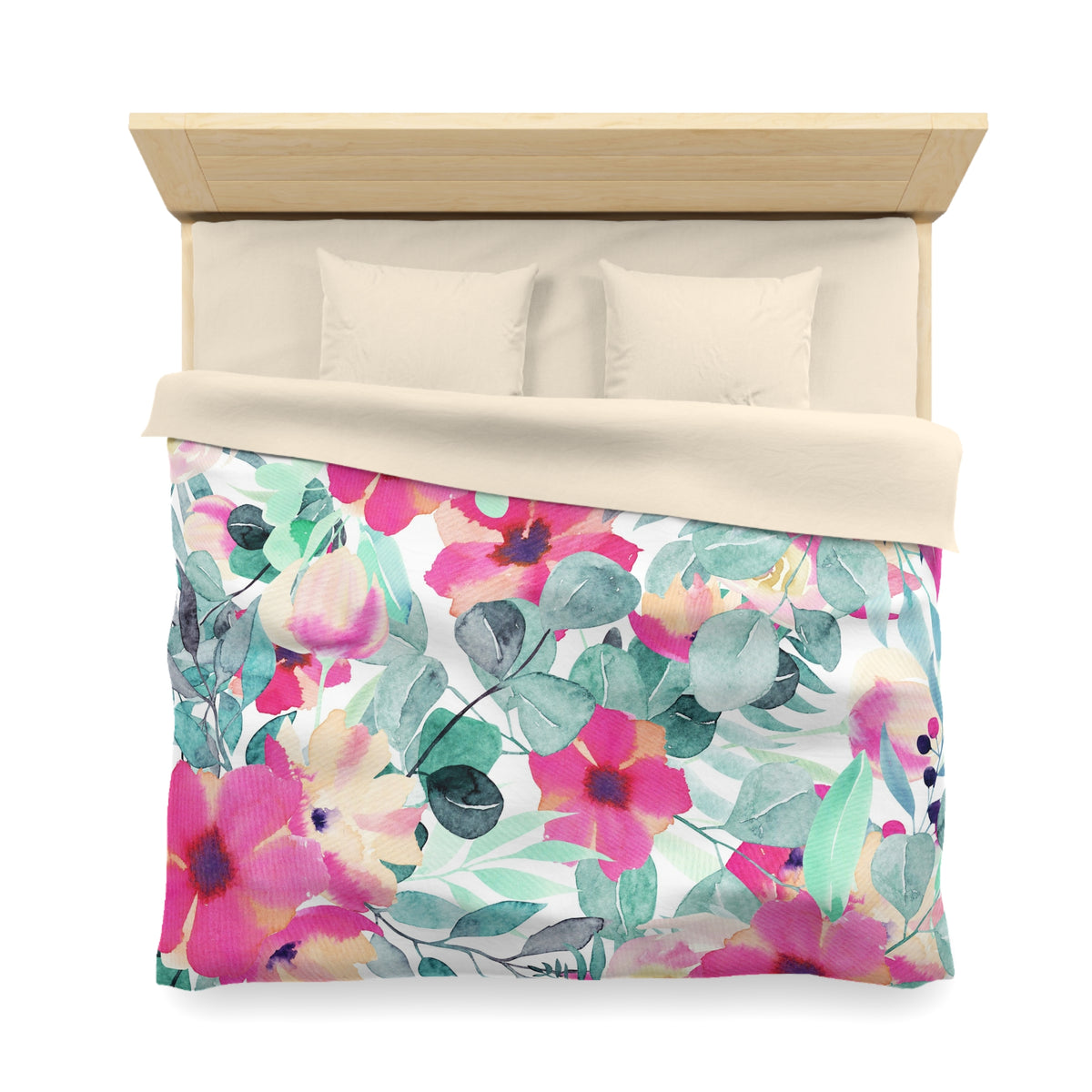 a bed with a floral print duvet cover and pillows.
